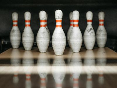 Close up of sports equipment on a white floor.